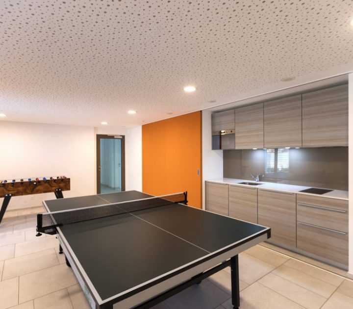 basement game room with table tennis and table football